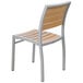 A BFM Seating outdoor side chair with a wood back and metal frame.