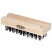 A wooden FMP grill brush head with black bristles.