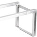 A metal frame with a square shape on a Bakers Pride countertop charbroiler.