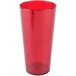A stack of Carlisle ruby red plastic tumblers.