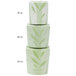 A stack of green SmartServ microwavable take-out containers with a nature print lid.