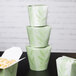 A stack of SmartServ nature print paper take-out containers.
