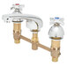 A T&S brass deck mount lavatory faucet with 4-arm handles.