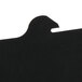 A close-up of a black piece of paper with a black bird silhouette.