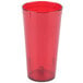 A close up of a Carlisle ruby red plastic tumbler with a white background.