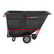 A black Rubbermaid BRUTE tilt truck with a red handle.