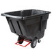 A large black plastic container on a red cart.