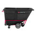 A black Rubbermaid Brute tilt truck with a red handle.