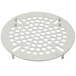 A white metal grate with holes on a T&S waste drain valve.