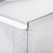 A close up of a stainless steel splashguard corner.