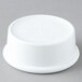 A white plastic Carlisle ramekin lid.
