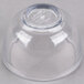 A Carlisle clear plastic souffle cup with a clear lid.