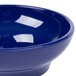 A close up of a Carlisle cobalt blue plastic salsa bowl.