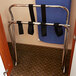 A metal CSL luggage rack with black straps.