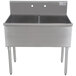 An Advance Tabco stainless steel two compartment sink on a counter.