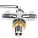 A silver Equip by T&S deck-mounted faucet with silver and gold brass connectors.