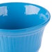 A sky blue cast aluminum bowl with a rim.