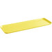 A yellow rectangular Cambro market tray with a handle.