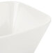 A close up of a white square porcelain bowl.