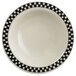 A white china bowl with black and white checkered trim.