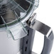 A close-up of a stainless steel bowl assembly for a Robot Coupe commercial food processor.