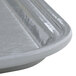 A close-up of a rectangular pearl gray fiberglass tray.
