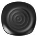 A black Elite Global Solutions square melamine plate with a spiral pattern.
