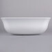 A white Carlisle flared melamine bowl on a white surface.
