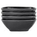 A stack of three black Elite Global Solutions square bowls.