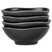 A stack of three black Elite Global Solutions Ore bowls.
