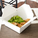 A white Fold-Pak Bio-Pak take-out box of food on a table.