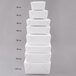 A stack of white Fold-Pak Bio-Pak paper take-out boxes.