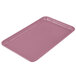 A rectangular pink Cambro fiberglass tray on a counter.