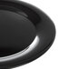 A close-up of a Carlisle black melamine round platter with a wide rim.