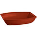 A red rectangular Tablecraft salad bowl with a curved edge.