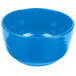 A Tablecraft sky blue cast aluminum fruit bowl with a handle.