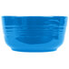 A Tablecraft sky blue cast aluminum bowl with a handle on a white background.