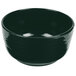 A hunter green cast aluminum fruit bowl with a curved edge.