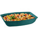 A hunter green Tablecraft cast aluminum oblong bowl filled with pasta salad and vegetables.