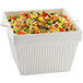 A Tablecraft white cast aluminum square bowl filled with salad and vegetables.