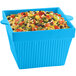 A blue square Tablecraft bowl filled with a mix of vegetables.
