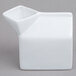 An American Metalcraft white ceramic milk carton creamer.