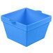 A cobalt blue square cast aluminum bowl with a handle.