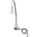 A T&S chrome hands-free sensor faucet with hoses attached.