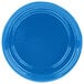 A blue cast aluminum souffle bowl with ridges on the rim.