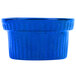 A blue cast aluminum souffle bowl with ridges.
