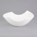 A white 10 Strawberry Street Samurai bowl with a curved edge.