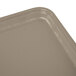 A close up of a rectangular Cambro desert tan fiberglass tray.