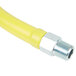 A close up of a yellow T&S Safe-T-Link gas connector hose.