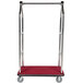 A stainless steel luggage cart with a red carpet on the platform and clothing rail.